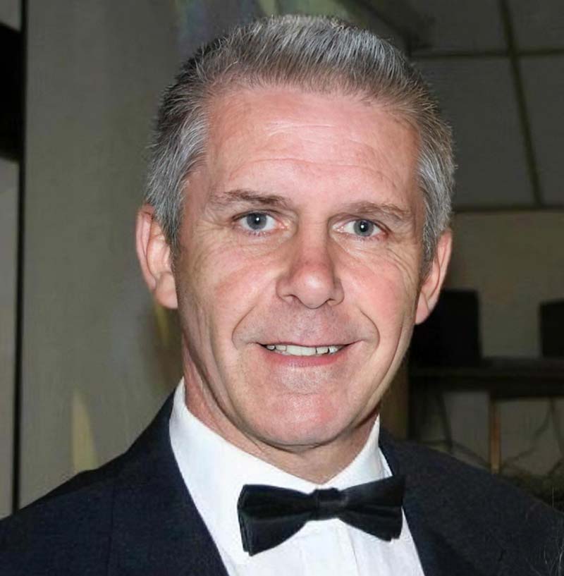 Ian Massingham, smartly dressed in a dinner jacket and black bow tie.