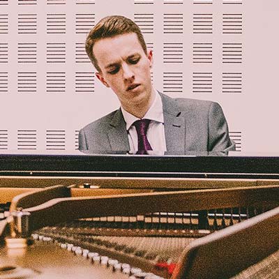 Iwan Owen plays a grand piano
